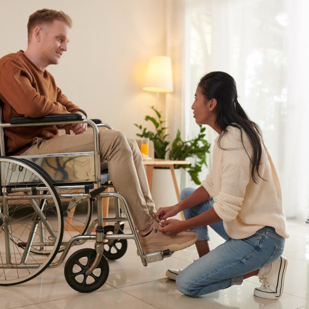 Woman Helping Husband with Disability